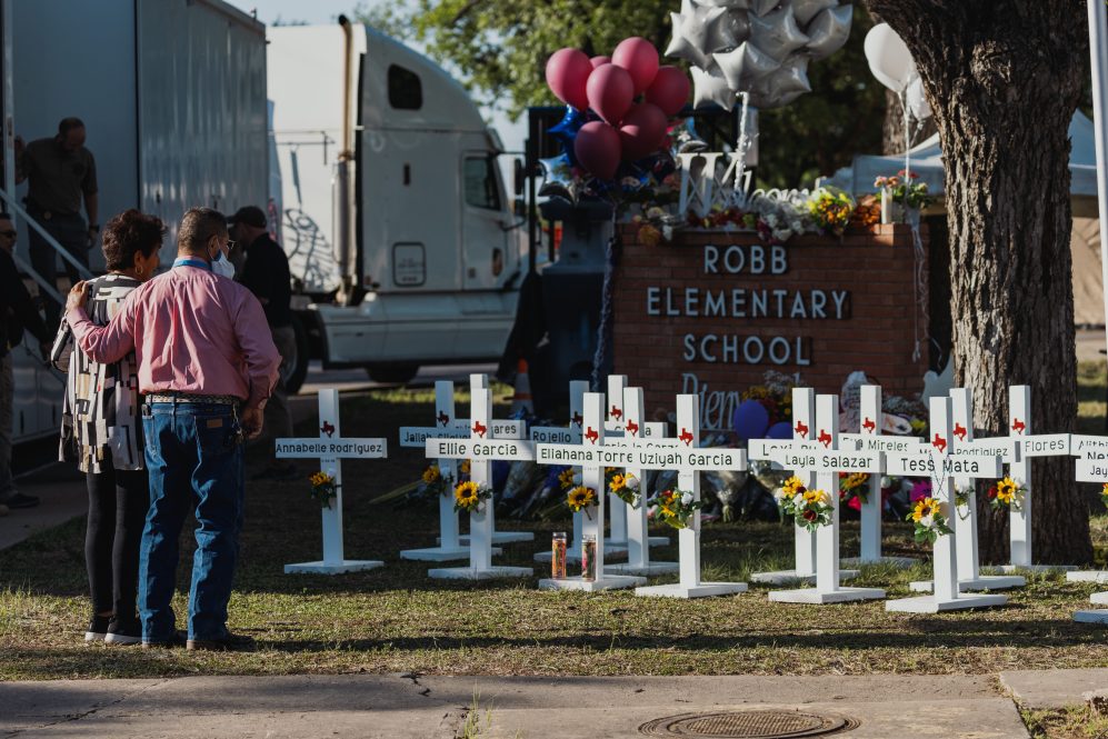 Crosses bearing the names of the victims of a mass shooting in front of Robb Elementary School on May 26, 2022 in Uvalde, Texas.