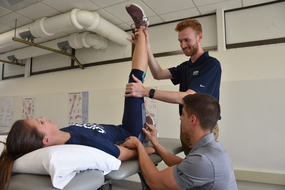 DPT students take hip flexion goniometer measurements. (Kevin Noonan/UConn Photo)