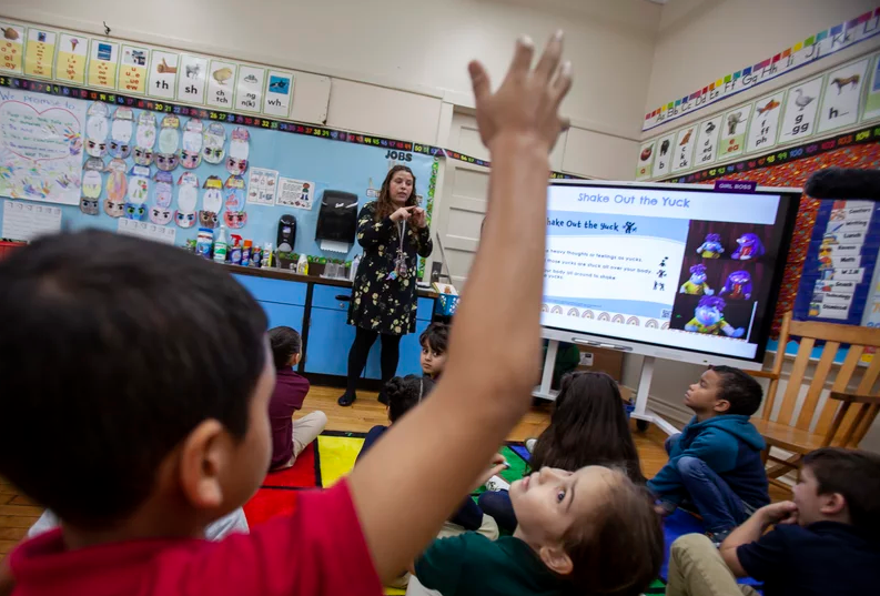First-grade teacher Leticia Denoya uses puppets, as part of the Feel Your Best Self program Photo credit Ryan T. Conaty for NPR